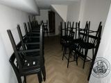 many chairs that are lined up in a room