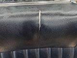 a black piece of luggage sitting on top of a table