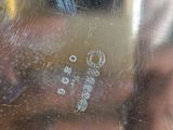 reflection of a woman in a mirror with bubbles on the glass