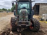 a tractor that is sitting in the dirt