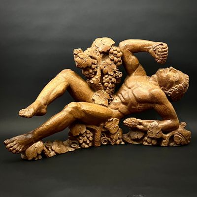 une image représentant une statue d'un homme et d'une femme allongés sur un rocher