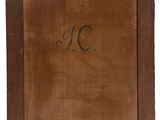 an old wooden picture frame with the letter c on it