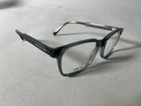 a pair of glasses sitting on a white surface