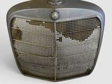 un radiateur à l'ancienne posé sur une surface blanche