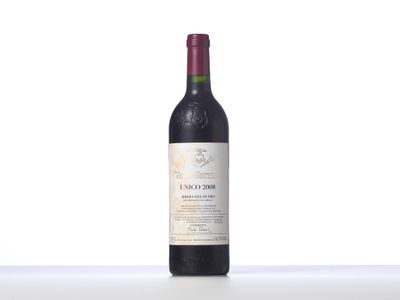 the bottle of red wine is sitting on the table