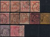 a group of stamps with different designs on them on a black surface