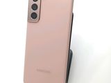 the back of a pink samsung galaxy s20 with a camera on top of it