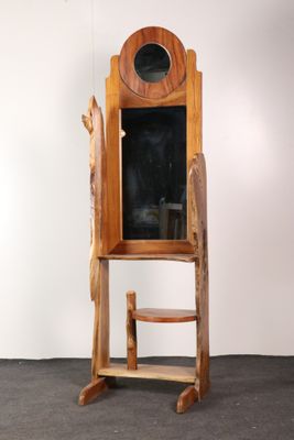 a wooden chair that is next to a wooden cabinet