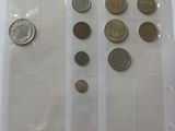 a lot of coins in a plastic bag on a table
