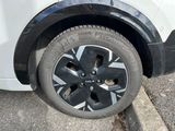 a close up of a tire on a white car