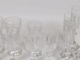 a lot of glasses that are sitting on a table