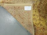 several rugs on the floor with a price tag on them