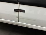 a close up of a car door with a sticker on it
