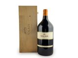 the bottle of wine is next to a wooden box