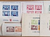 many different types of stamps on a wooden table