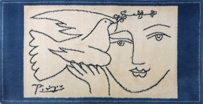 a blue and white rug with a drawing of a woman and a bird