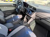 a view of the inside of a car from the driver ' s seat