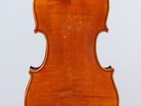an old violin with a wooden back and bow on a white background