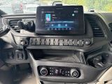 a car dashboard with a tablet on the dashboard