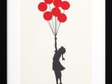 a black and white picture of a girl holding red balloons