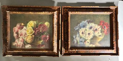 two framed pictures of flowers in a vase on the wall