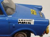 a blue toy car with a sticker on it