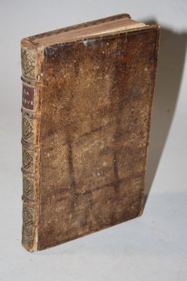 an old book that is sitting on a table