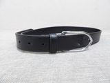 a close up of a black leather belt with a silver buckle