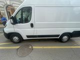 a white van that is parked on the side of the street