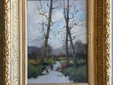 une peinture à l'huile représentant une rivière et des arbres, dans un cadre doré