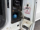 a close up of a car ' s door with a speaker in it