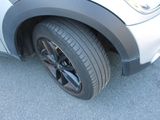 a close up of a car tire on the road