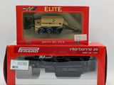 a box with a toy truck in it on a white surface