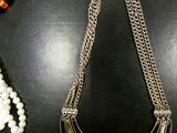 a necklace that has been placed on a table