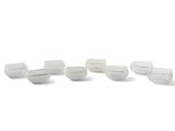 several white plastic cups are lined up on a white surface