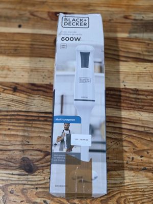 the box of a blender is sitting on a wooden table