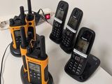 many cell phones that are sitting on a table