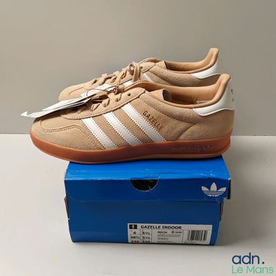 adidas gazelle trainers in tan and white on a blue box