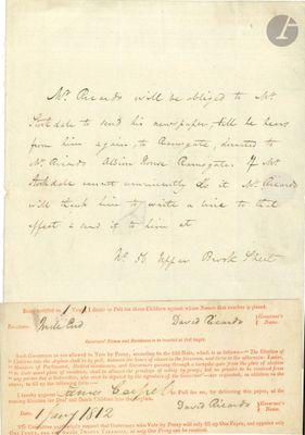 un vieux document sur lequel figure une lettre manuscrite, posé sur une table