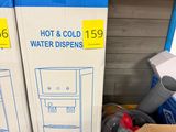 two boxes of hot and cold water dispensers in the store