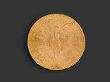 a gold coin with an image of an angel on it