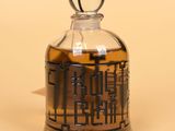 a glass jar with a glass stopper on it