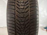 a close up of a tire on a white surface