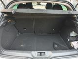 a trunk of a car with the back door open