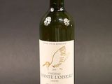 a bottle of wine that is sitting on a table
