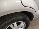 a close up of a tire on a car ' s rim