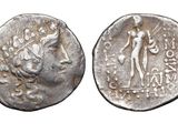 a close up of a coin with an image of a man on it