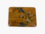 a wooden tray with a painting of a bird on it