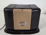 a black and tan box with a brown label on it