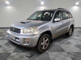 a picture of a silver toyota rav parked in a garage